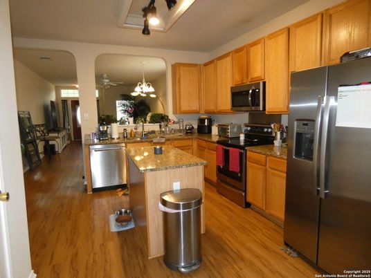 Chandelier, Dining room, Interior, Kitchen, Stainless Steel Appliances, Wood Texture Flooring