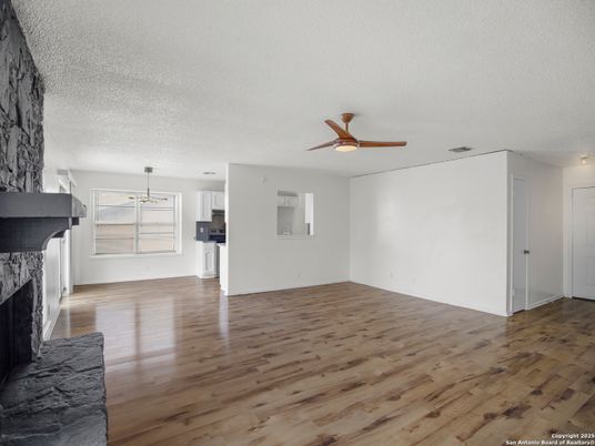 Empty room, Fireplace, Interior, Kitchen, Pendant Lights, Wood Texture Flooring