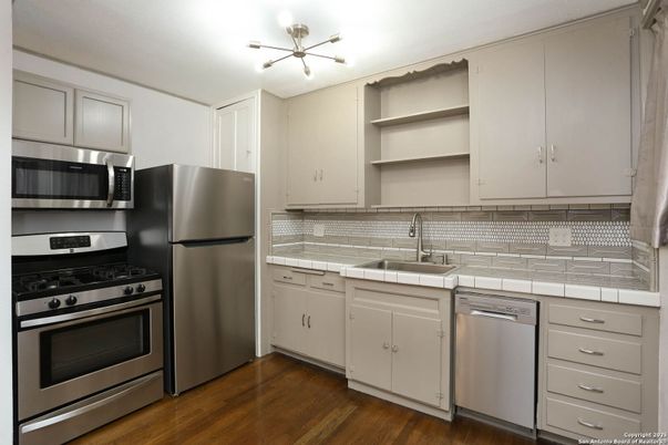 Interior, Kitchen, Stainless Steel Appliances, Tile Countertops, Wood Texture Flooring