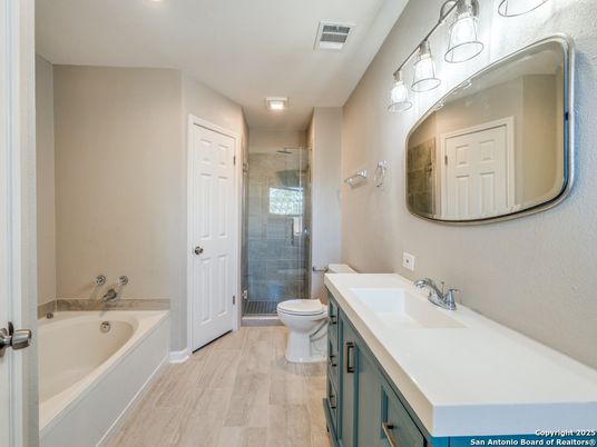 Bathroom, Dual Sink Vanities, Glass Shower, Interior, Recessed Lighting, Wood Texture Flooring