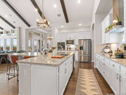 Chandelier, Dining room, Interior, Kitchen, Pendant Lights, Recessed Lighting, Stainless Steel Appliances, Wooden Beams, Wood Texture Flooring