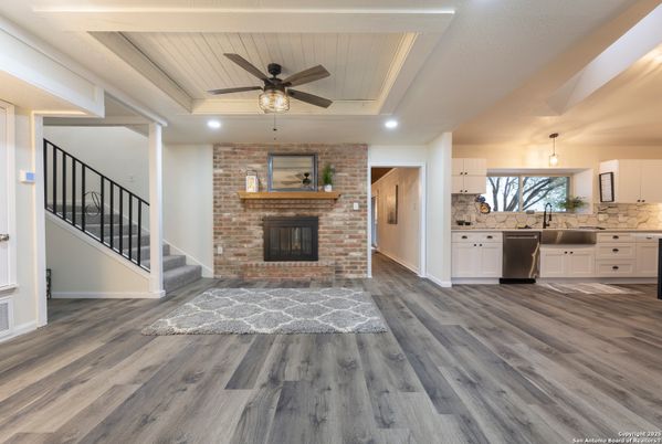 Fireplace, Interior, Kitchen, Pendant Lights, Recessed Lighting, Stone Walls, Wood Texture Flooring