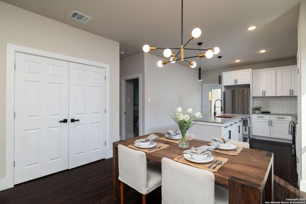 Dining room, Interior, Kitchen, Pendant Lights, Recessed Lighting, Stainless Steel Appliances, Wood Texture Flooring