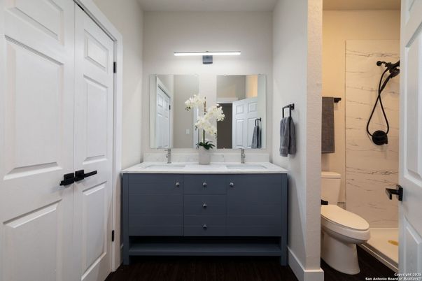 Bathroom, Dual Sink Vanities, Interior, Marble Walls, Wood Texture Flooring