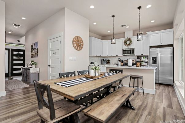 Dining room, Interior, Kitchen, Pendant Lights, Recessed Lighting, Stainless Steel Appliances, Wood Texture Flooring