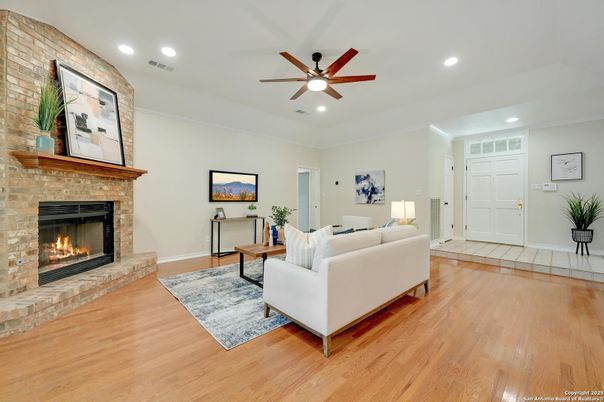 Fireplace, Interior, Living room, Recessed Lighting, Stone Walls, Wood Texture Flooring