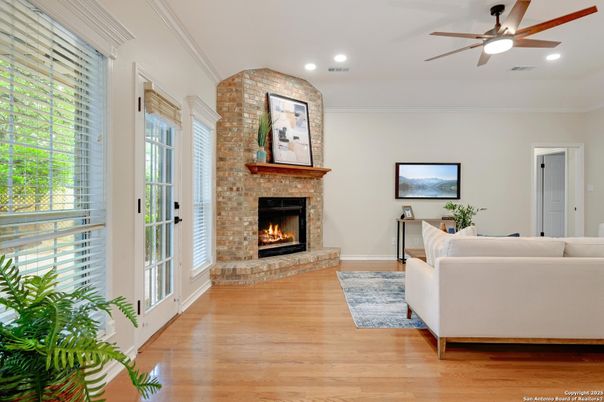 Fireplace, Interior, Living room, Recessed Lighting, Stone Walls, Wood Texture Flooring