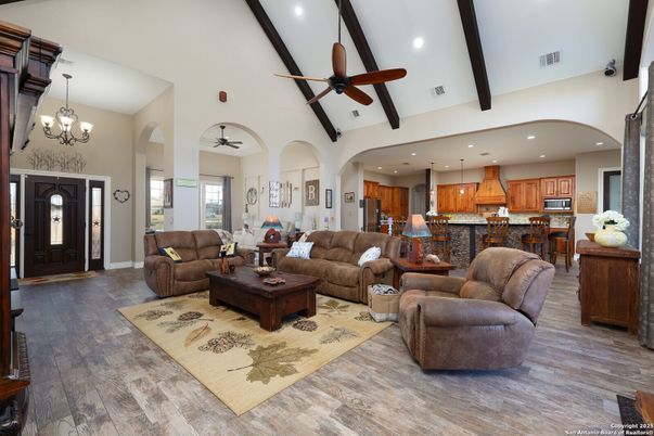 Chandelier, Interior, Kitchen, Living room, Pendant Lights, Recessed Lighting, Stainless Steel Appliances, Wood Texture Flooring