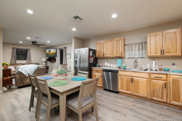 Dining room, Interior, Kitchen, Living room, Recessed Lighting, Stainless Steel Appliances, Wood Texture Flooring