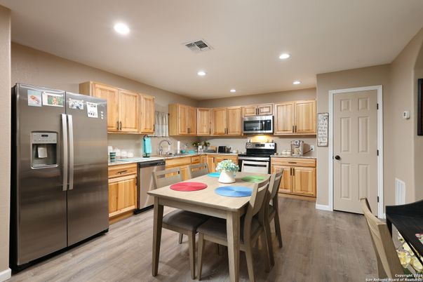 Dining room, Interior, Kitchen, Recessed Lighting, Stainless Steel Appliances, Wood Texture Flooring