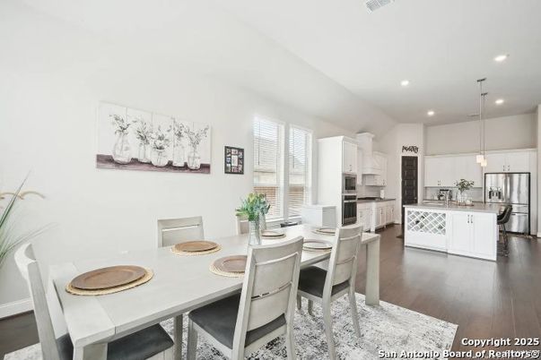 Dining room, Interior, Kitchen, Pendant Lights, Recessed Lighting, Stainless Steel Appliances, Wood Texture Flooring