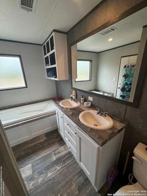 Bathroom, Dual Sink Vanities, Interior, Recessed Lighting, Wood Texture Flooring