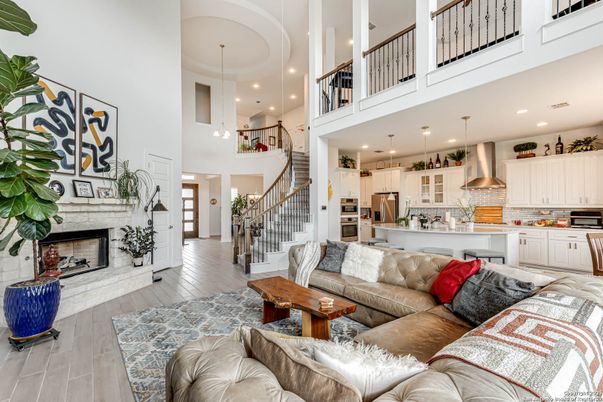 Fireplace, Interior, Kitchen, Living room, Pendant Lights, Recessed Lighting, Stainless Steel Appliances, Wood Texture Flooring