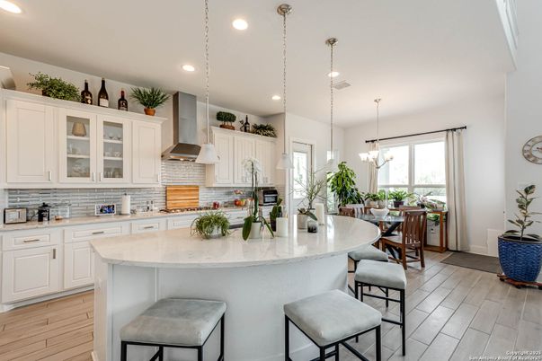 Chandelier, Dining room, Interior, Kitchen, Pendant Lights, Recessed Lighting, Stainless Steel Appliances, Wood Texture Flooring