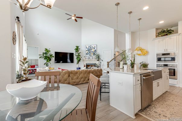 Dining room, Fireplace, Interior, Kitchen, Living room, Pendant Lights, Recessed Lighting, Stainless Steel Appliances, Wood Texture Flooring