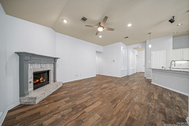 Empty room, Fireplace, Interior, Kitchen, Pendant Lights, Recessed Lighting, Wood Texture Flooring