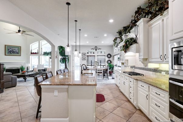 Dining room, Fireplace, Interior, Kitchen, Living room, Pendant Lights, Recessed Lighting, Stainless Steel Appliances