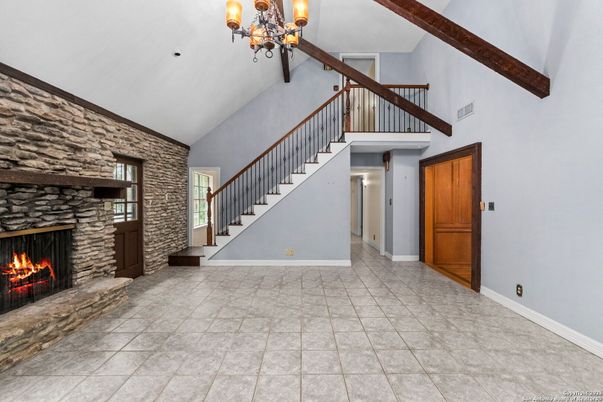 Chandelier, Fireplace, Interior, Stone Walls, Wooden Beams