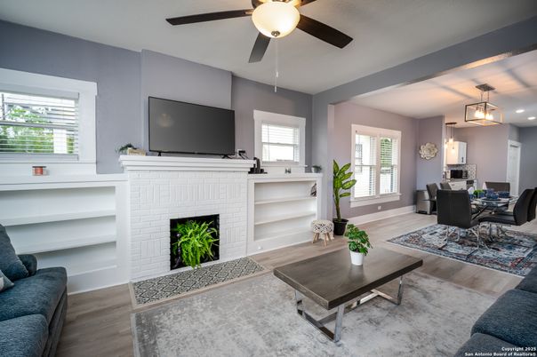 Dining room, Fireplace, Interior, Living room, Pendant Lights, Recessed Lighting, Wood Texture Flooring