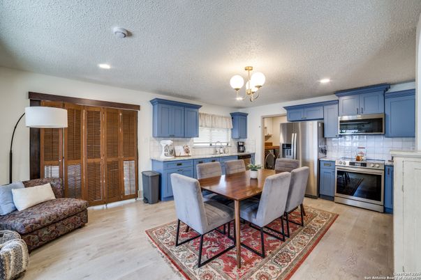 Chandelier, Dining room, Interior, Kitchen, Recessed Lighting, Stainless Steel Appliances, Wood Texture Flooring