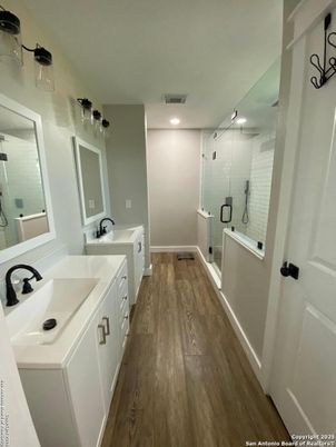 Bathroom, Dual Sink Vanities, Glass Shower, Interior, Recessed Lighting, Wood Texture Flooring