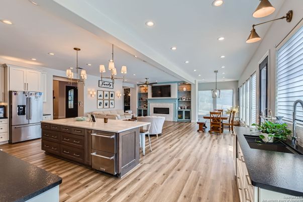 Dining room, Fireplace, Interior, Kitchen, Living room, Pendant Lights, Recessed Lighting, Stainless Steel Appliances, Wood Texture Flooring