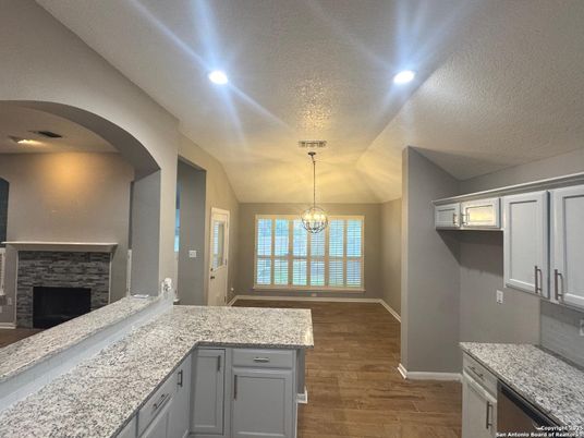 Fireplace, Interior, Pendant Lights, Recessed Lighting, Wood Texture Flooring