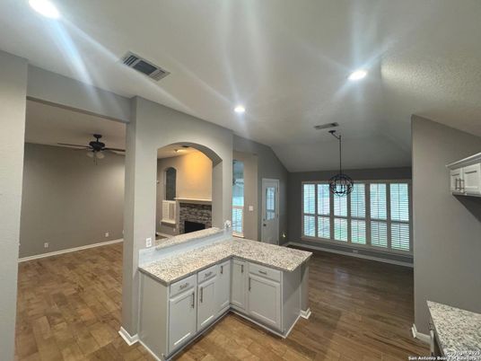 Fireplace, Interior, Pendant Lights, Recessed Lighting, Wood Texture Flooring