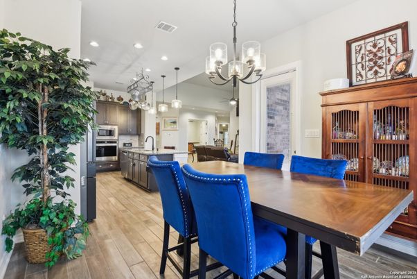 Dining room, Interior, Kitchen, Pendant Lights, Recessed Lighting, Stainless Steel Appliances, Wood Texture Flooring