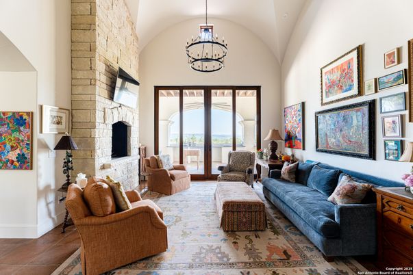 Chandelier, Fireplace, Interior, Living room, Pendant Lights, Stone Walls