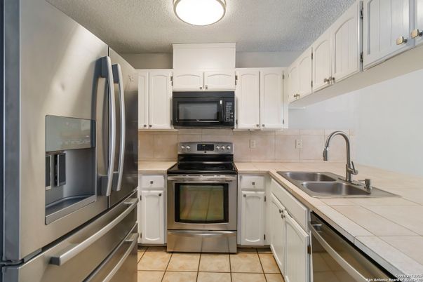 Interior, Kitchen, Stainless Steel Appliances, Tile Countertops
