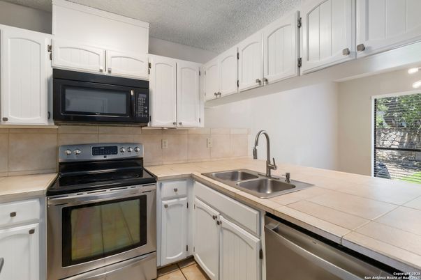 Interior, Kitchen, Stainless Steel Appliances, Tile Countertops