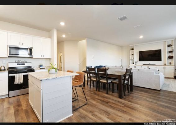 Dining room, Interior, Kitchen, Recessed Lighting, Stainless Steel Appliances, Wood Texture Flooring