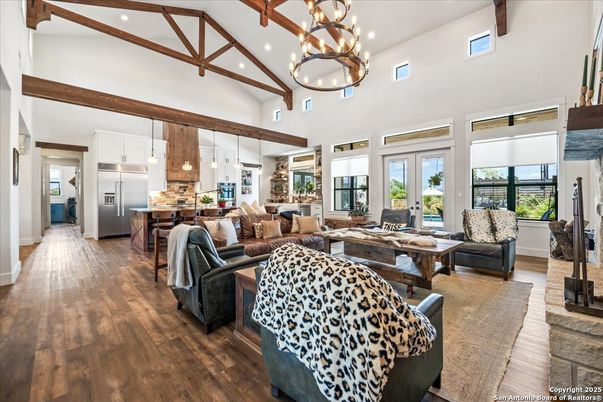 Chandelier, Interior, Kitchen, Living room, Pendant Lights, Recessed Lighting, Stainless Steel Appliances, Wooden Beams, Wood Texture Flooring