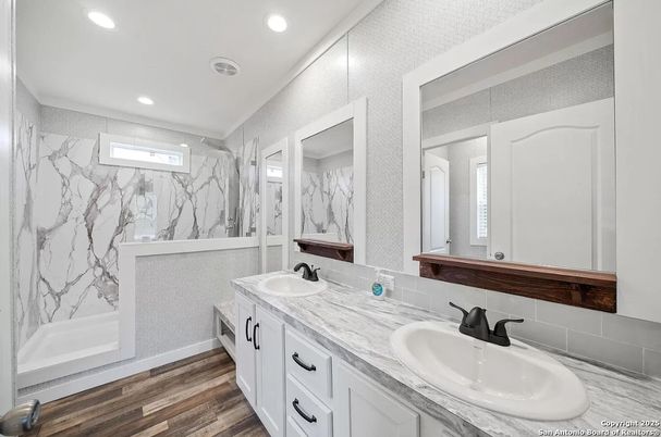 Bathroom, Dual Sink Vanities, Interior, Marble Walls, Recessed Lighting, Wood Texture Flooring