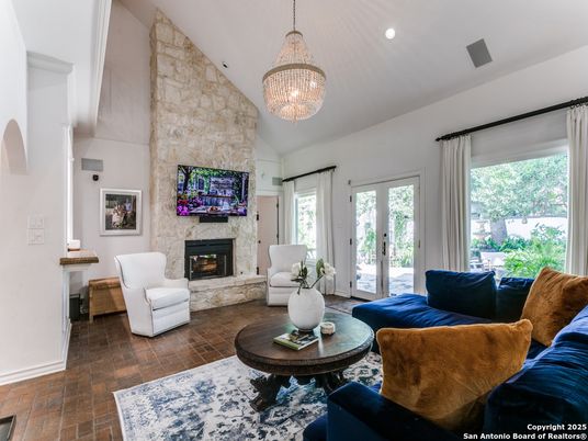 Chandelier, Fireplace, Interior, Living room, Recessed Lighting, Stone Walls