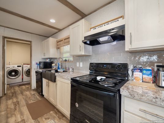 Interior, Kitchen, Recessed Lighting, Washer, Wood Texture Flooring