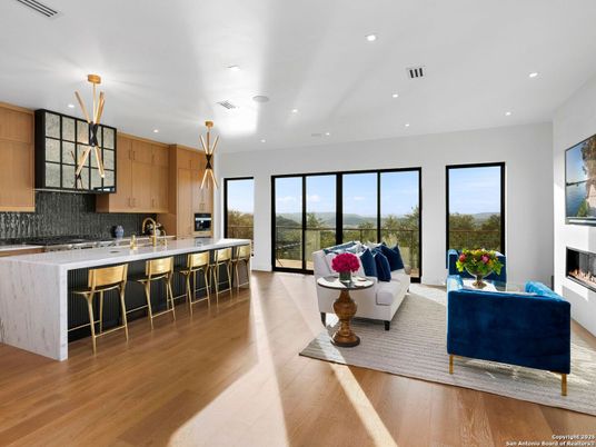 Fireplace, Interior, Kitchen, Living room, Pendant Lights, Recessed Lighting, Stainless Steel Appliances, Wood Texture Flooring