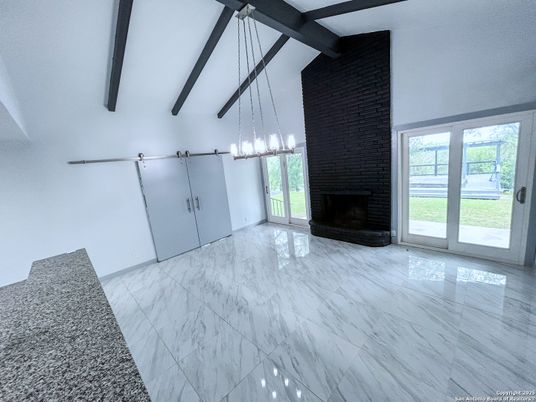 Empty room, Fireplace, Interior, Marble, Pendant Lights, Wooden Beams