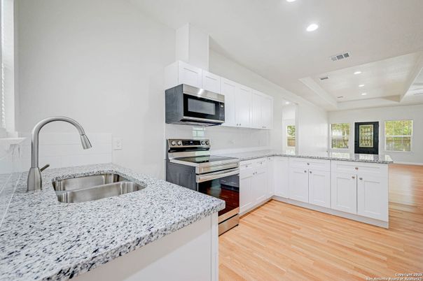 Interior, Kitchen, Recessed Lighting, Stainless Steel Appliances, Wood Texture Flooring