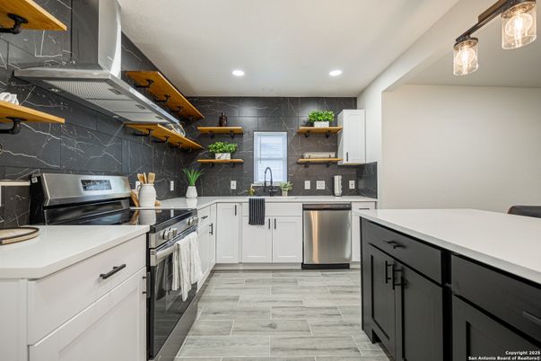 Interior, Kitchen, Marble Walls, Recessed Lighting, Stainless Steel Appliances, Wood Texture Flooring