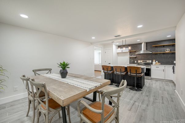 Dining room, Interior, Kitchen, Pendant Lights, Recessed Lighting, Stainless Steel Appliances, Wood Texture Flooring