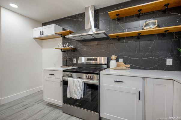 Interior, Kitchen, Marble Walls, Recessed Lighting, Stainless Steel Appliances, Wood Texture Flooring