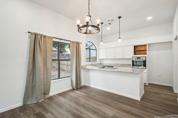 Chandelier, Interior, Kitchen, Pendant Lights, Recessed Lighting, Stainless Steel Appliances, Wood Texture Flooring