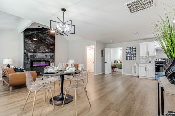 Dining room, Fireplace, Interior, Kitchen, Living room, Pendant Lights, Recessed Lighting, Stainless Steel Appliances, Wood Texture Flooring