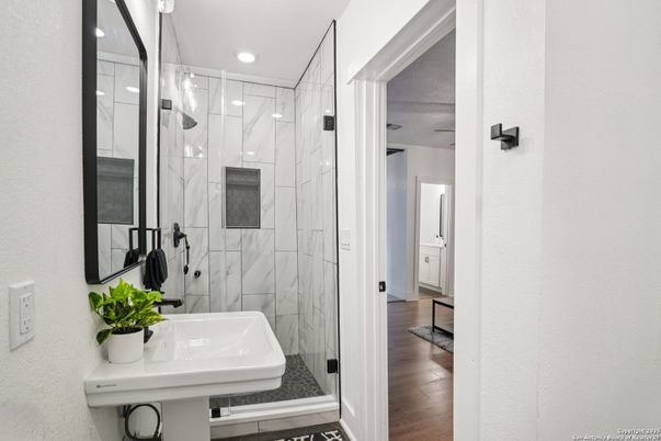 Bathroom, Glass Shower, Interior, Marble Walls, Recessed Lighting, Wood Texture Flooring