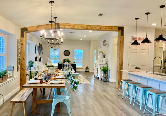 Chandelier, Dining room, Interior, Kitchen, Pendant Lights, Recessed Lighting, Wooden Beams, Wood Texture Flooring