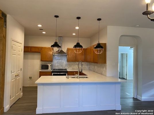 Interior, Kitchen, Pendant Lights, Recessed Lighting, Stainless Steel Appliances, Wood Texture Flooring