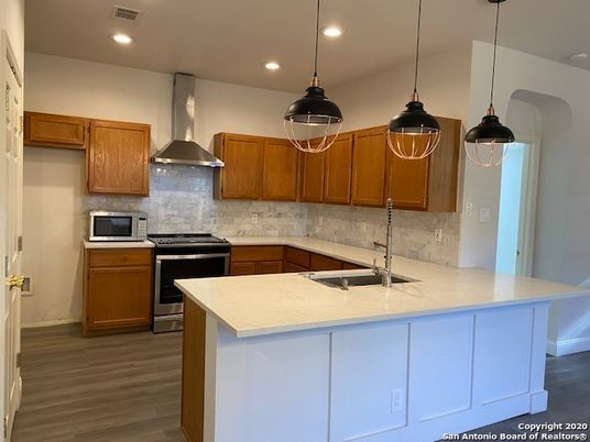Interior, Kitchen, Pendant Lights, Recessed Lighting, Stainless Steel Appliances, Wood Texture Flooring