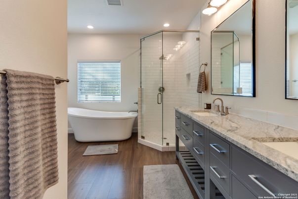 Bathroom, Dual Sink Vanities, Free Standing Baths, Glass Shower, Interior, Recessed Lighting, Wood Texture Flooring
